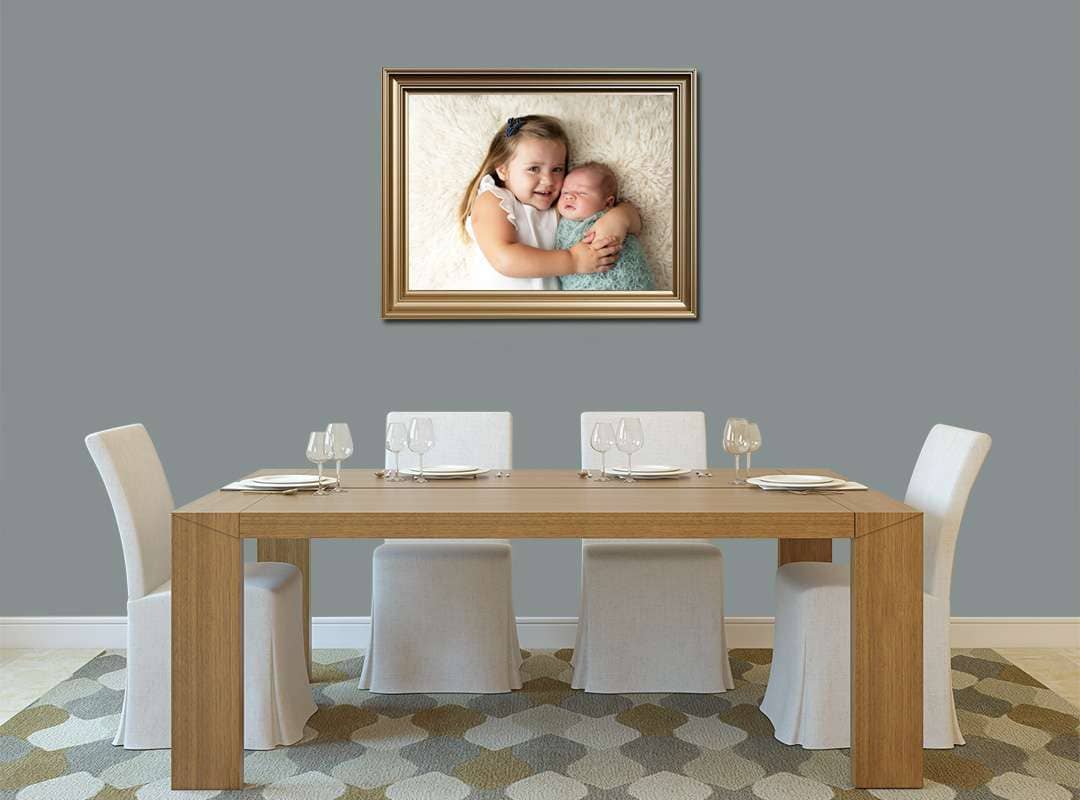 West Sussex photographer showcasing framed newborn print in lounge setting